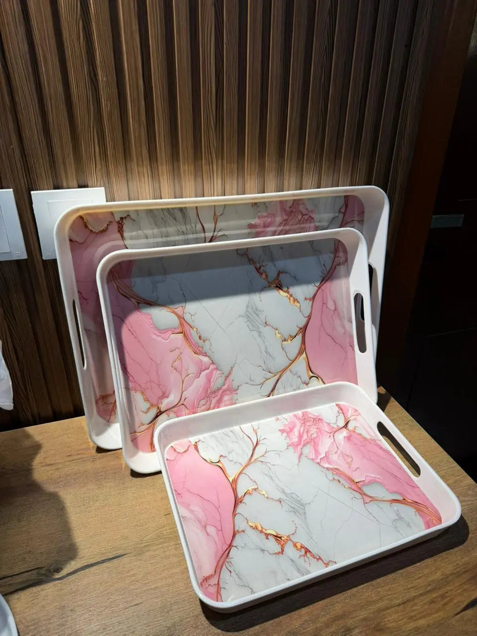 Takalluf pink marble melamine serving trays, close-up of gold veining