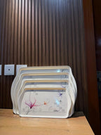 Takalluf floral melamine nesting tray set, close-up of pink and purple floral pattern